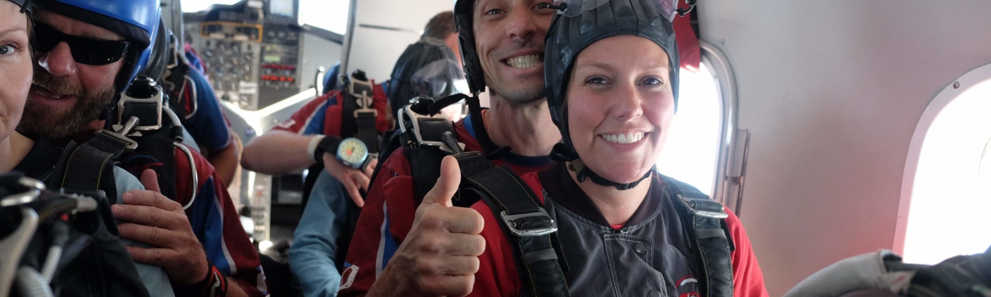 group skydiving jump out of a plane